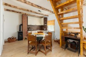 a kitchen with a table and chairs in a room at Lake house Sreten in Šavnik
