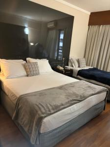 Postel nebo postele na pokoji v ubytování Hotel Paulista Plaza MCR