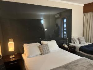 Postel nebo postele na pokoji v ubytování Hotel Paulista Plaza MCR