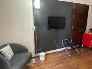 TV a/nebo společenská místnost v ubytování Hotel Paulista Plaza MCR