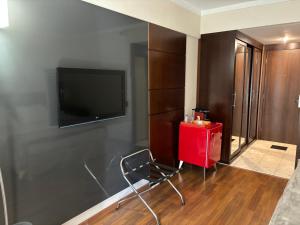TV a/nebo společenská místnost v ubytování Hotel Paulista Plaza MCR