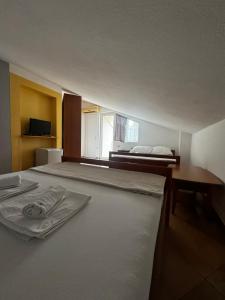 Кровать или кровати в номере Guesthouse Vila Tamburic