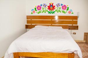 Ліжко або ліжка в номері Hospedaje Perlaschallay