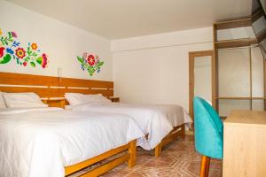 Cama ou camas em um quarto em Hospedaje Perlaschallay