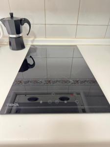 a stove top in a kitchen with a coffee pot at Cabildo 3 in Sanlúcar de Barrameda +38 photos