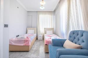 Postel nebo postele na pokoji v ubytování TUSEM KONAKLARI + 12 fotografií