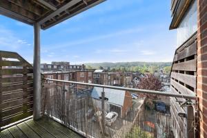 a balcony with a view of a city at High Wycombe Short Stay Apartment in High Wycombe