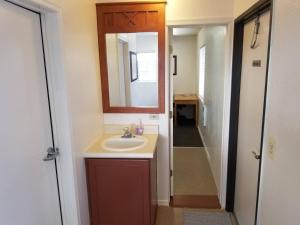 a bathroom with a sink and a mirror at 083A Affordable Getaway near South Rim Sleeps 6 in Valle