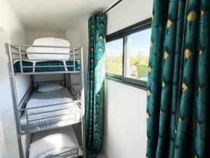 Ένα ή περισσότερα κρεβάτια σε δωμάτιο στο Appartement 50m2 spa privé