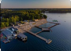 an aerial view of a dock in a body of water at Apartament nad jeziorem Ukiel in Olsztyn