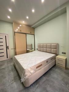a large bedroom with a large bed in it at Buzovna Delmar Luxury Residence in Baku