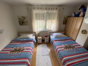 Oriental House tesisinde bir odada yatak veya yataklar