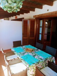 a table with a table cloth on top of it at Apartamento Valentino's- Alpujarra in Carataunas