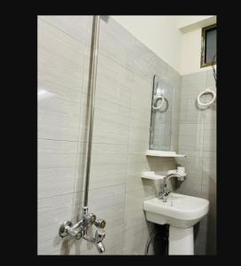 a bathroom with a shower and a toilet and a sink at River Vibes Guest House in Muzaffarabad