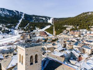 an aerial view of a town with snow covered roofs at Les Fermes de Cal Panche : Le Cabanat in Les Angles