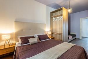 a bedroom with a large bed in a room at Agritur Michelotti Giancarlo in Arco