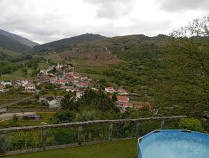 a view of a village in the hills at Casa das Leiras in Loivos da Ribeira +11 photos