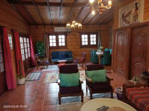 a large living room with chairs and a table at Roof of Comfort & Calm in Maadi in Cairo