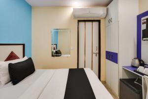 Krevet ili kreveti u jedinici u okviru objekta OYO Hotel Gold Star