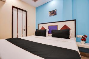 Krevet ili kreveti u jedinici u okviru objekta OYO Hotel Gold Star