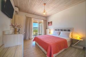 Postel nebo postele na pokoji v ubytování Leonidas Resort