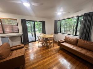 a living room with a couch and a table at Tiona Holiday Park in Tiona
