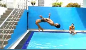 a man is diving into a swimming pool at Ayansa in Homagama