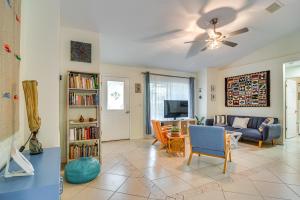 a living room with a couch and a tv at Lovely St Petersburg Home with Backyard Oasis in St Petersburg