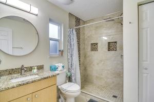 a bathroom with a shower and a toilet and a sink at Lovely St Petersburg Home with Backyard Oasis in St Petersburg +24 photos
