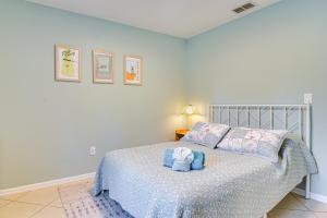 a bedroom with a bed with a stuffed animal on it at Lovely St Petersburg Home with Backyard Oasis in St Petersburg