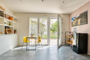 a kitchen with a table and a refrigerator at Residence Diamante in Villorba