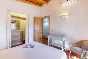 Cama ou camas em um quarto em Villa Itaca - Residence Cala Francese
