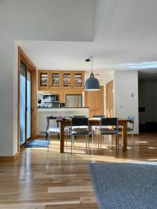 a kitchen with a dining room table and chairs at Ski in Ski out, modern alpine chic in Vail