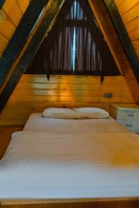 Tempat tidur dalam kamar di Celis Sapanca