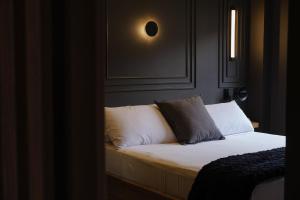 Säng eller sängar i ett rum på BINDI