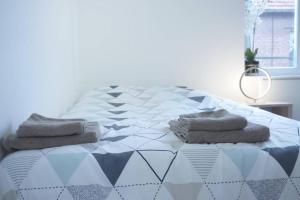 Tempat tidur dalam kamar di Studio Cosy 2 Proche gare