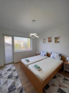 Postel nebo postele na pokoji v ubytování R&D Central Apartment