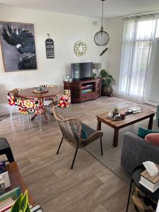 a living room with a couch and a table at Sunshine Four in Salisbury