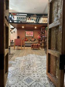 a view of a living room with a couch at “Encantador Loft” - en el corazón de San Pedro in Guadalajara