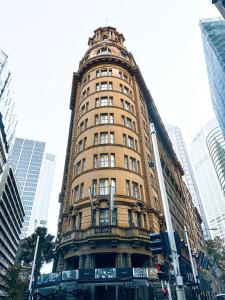 a tall building in the middle of a city at Radisson Blu Plaza Hotel Sydney in Sydney