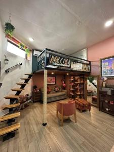 a living room with a loft bed and a wine cellar at “Encantador Loft” - en el corazón de San Pedro in Guadalajara