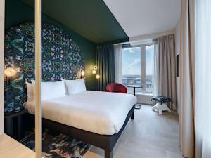 Rúm í herbergi á ibis Styles Rotterdam Ahoy