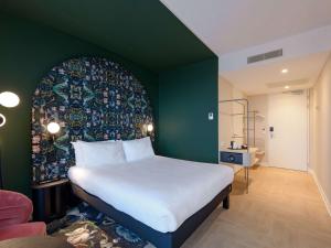 Rúm í herbergi á ibis Styles Rotterdam Ahoy