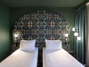Rúm í herbergi á ibis Styles Rotterdam Ahoy