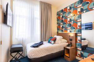 TV a/nebo společenská místnost v ubytování Best Western Metz Centre Gare