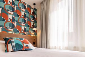 Postel nebo postele na pokoji v ubytování Best Western Metz Centre Gare