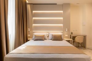 a bedroom with a large bed with two pillows at Bologna Centrale 1 in Bologna