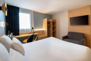 TV o dispositivi per l'intrattenimento presso Best Western Bourgoin Jallieu