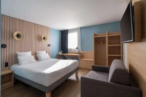 Letto o letti in una camera di Best Western Bourgoin Jallieu