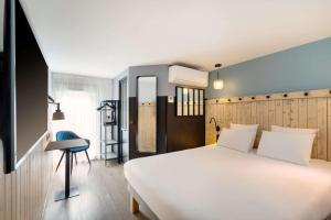 Letto o letti in una camera di Best Western Bourgoin Jallieu